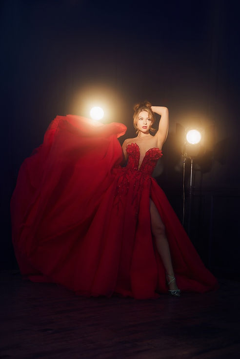 Woman in red gown, fashion portrait, dramatic lighting