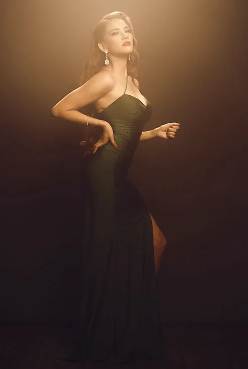 Woman in elegant green gown, fashion portrait
