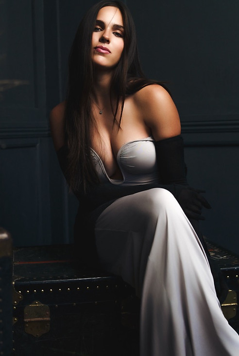 Woman in elegant white gown, fashion portrait