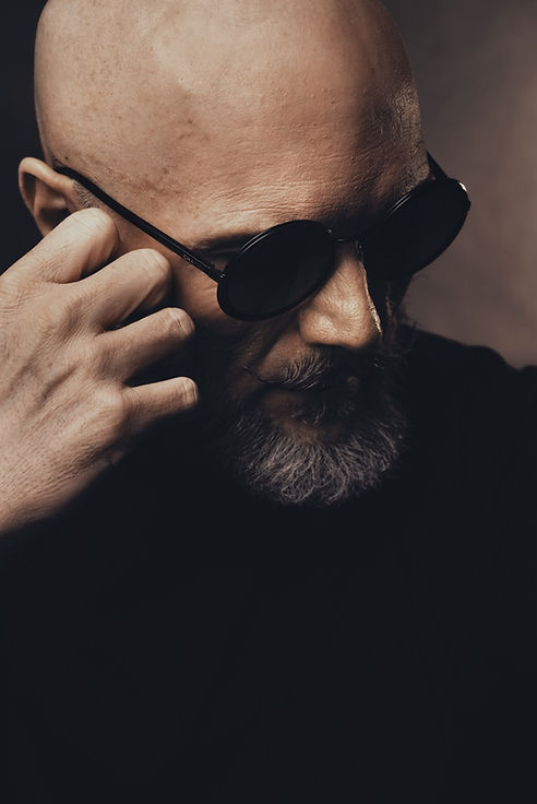 Close-up portrait of a man wearing sunglasses