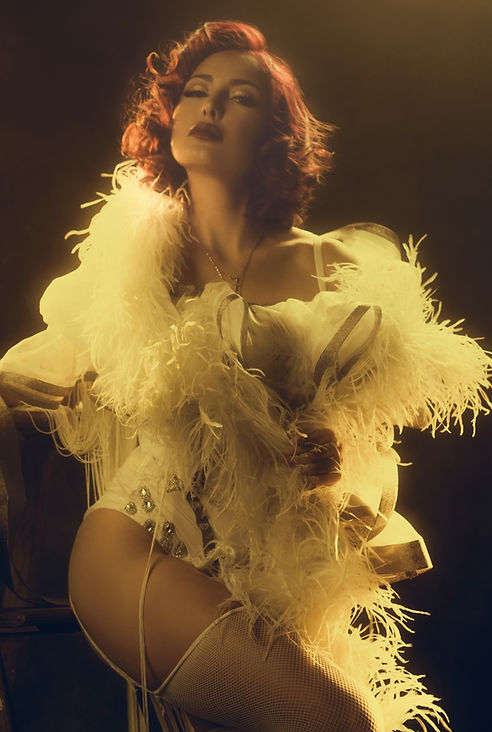 Portrait of a woman in vintage fashion, holding a hand mirror