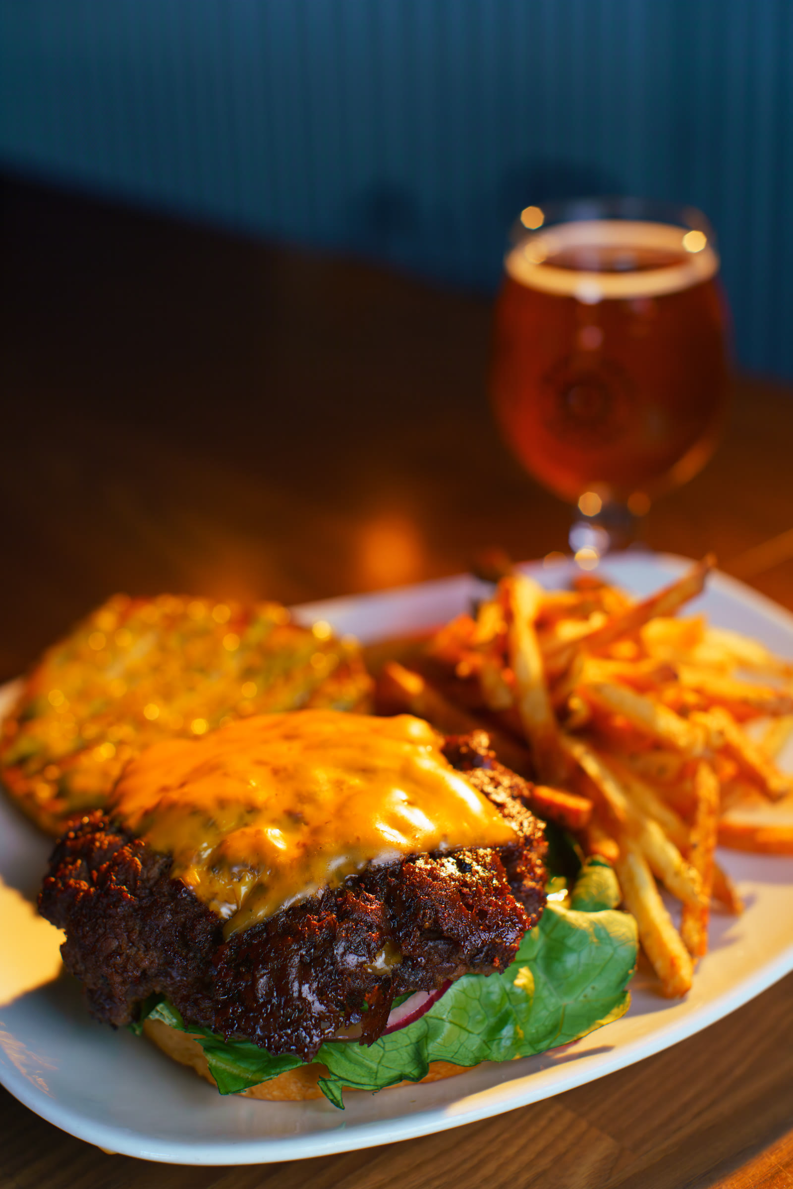 Burger, fries, and craft beer photographed for a restaurant campaign by Jordan Licon